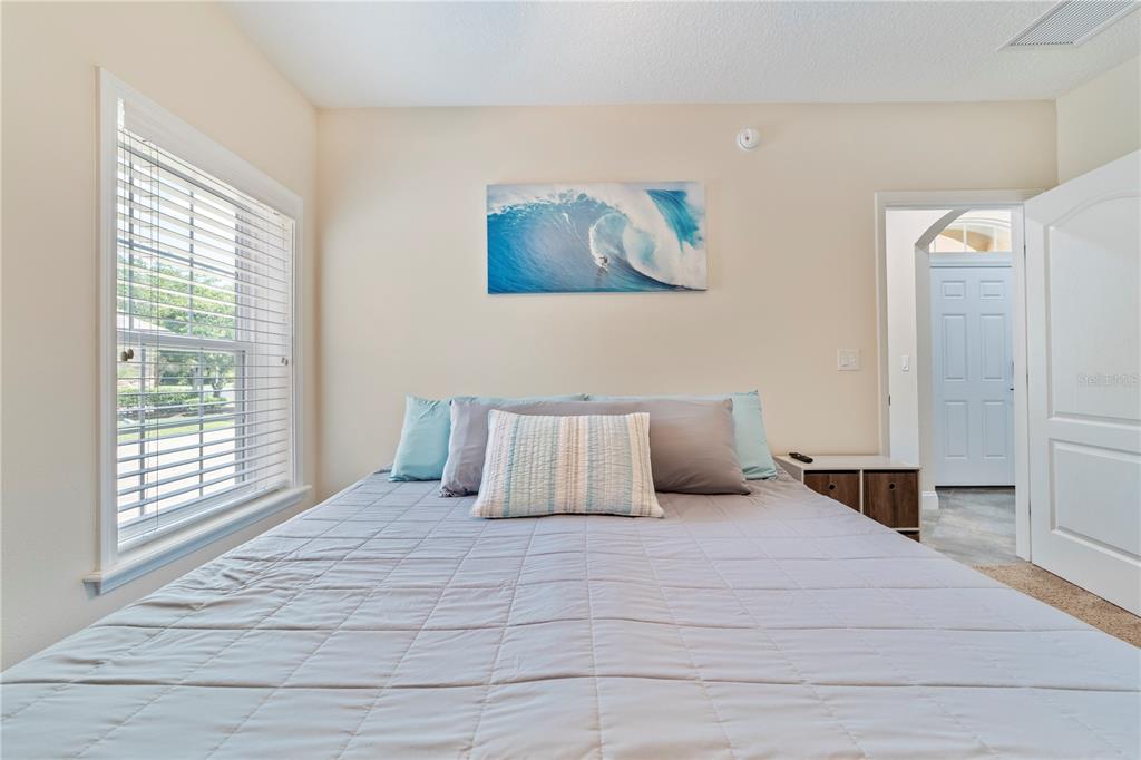 265 Pinehurst Pointe Drive St. Augustine, FL 32092 - Photo 43 of 66 a bedroom with a large bed and a window