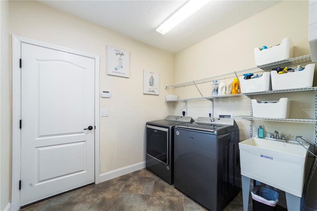 265 Pinehurst Pointe Drive St. Augustine, FL 32092 - Photo 48 of 66 a view of storage and utility room with washer and dryer