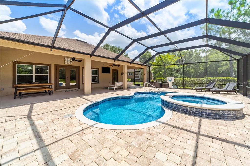265 Pinehurst Pointe Drive St. Augustine, FL 32092 - Photo 56 of 66 a view of a swimming pool with a patio