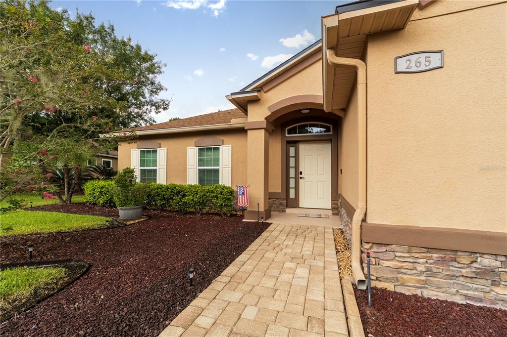 265 Pinehurst Pointe Drive St. Augustine, FL 32092 - Photo 65 of 66 a front view of a house with a yard