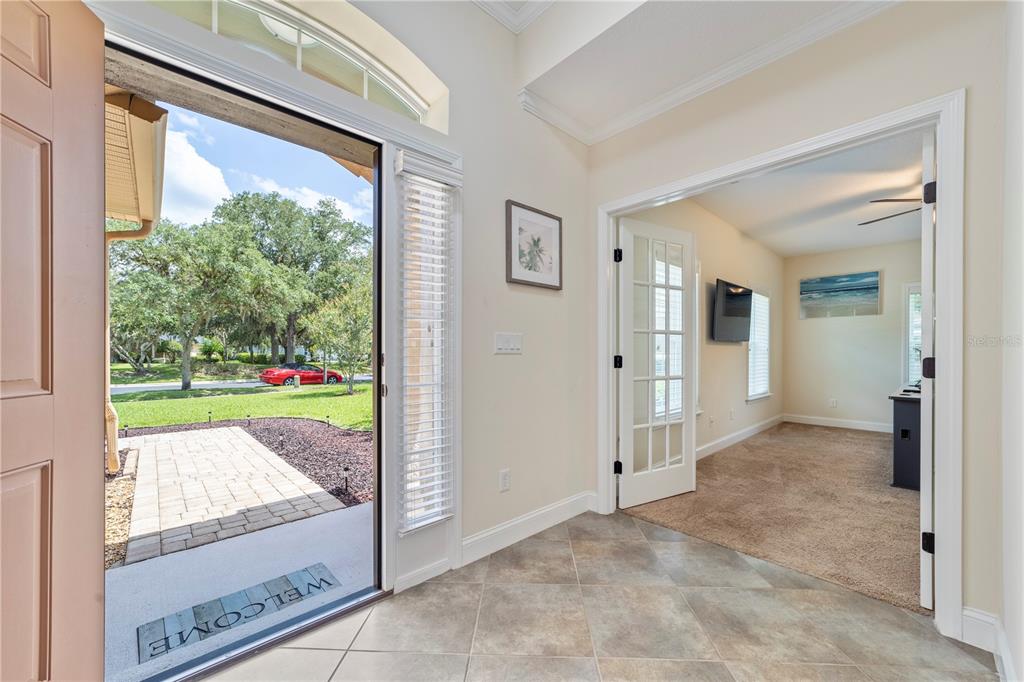 265 Pinehurst Pointe Drive St. Augustine, FL 32092 - Photo 9 of 66 a view of a porch with a floor to ceiling window
