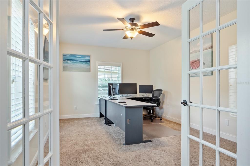 265 Pinehurst Pointe Drive St. Augustine, FL 32092 - Photo 10 of 66 a view of a workspace with furniture and a window