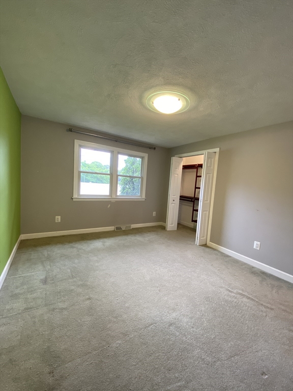 2 Travis Road Natick, MA 01760 - Photo 11 of 18 a view of an empty room with a window