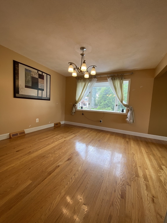 2 Travis Road Natick, MA 01760 - Photo 13 of 18 a view of room with window and wooden floor