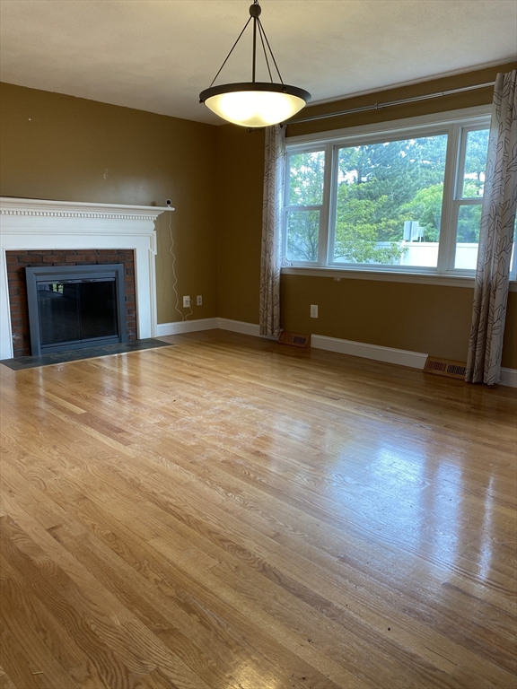 2 Travis Road Natick, MA 01760 - Photo 18 of 18 a view of an empty room with glass door and a window