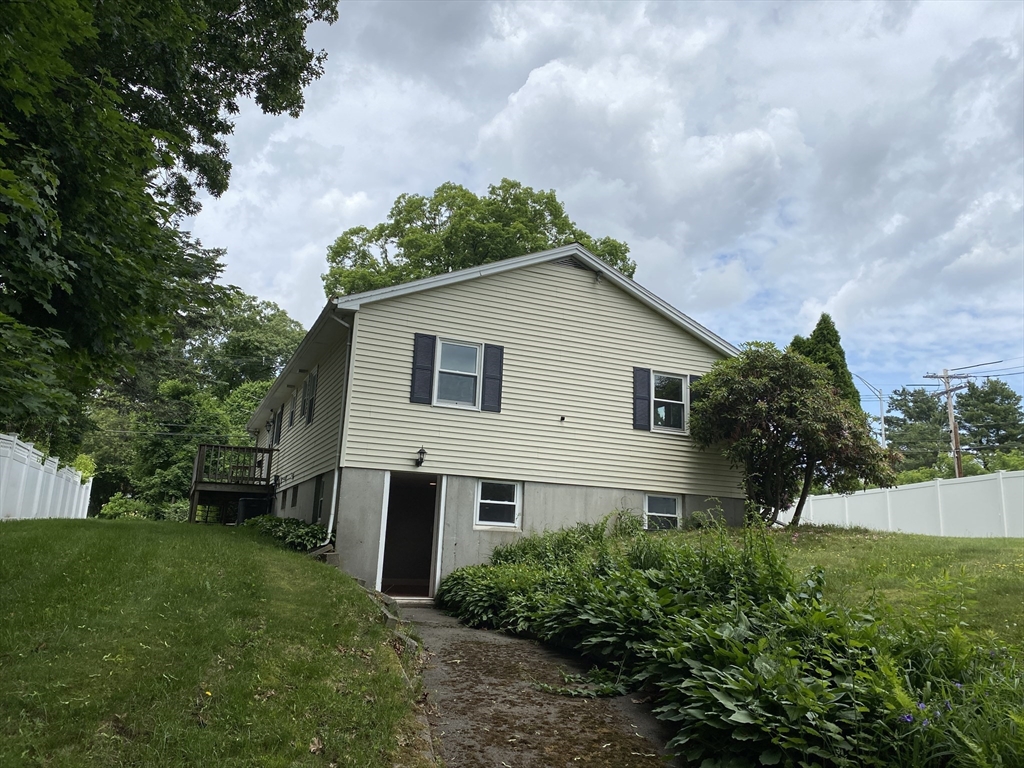 2 Travis Road Natick, MA 01760 - Photo 3 of 18 a house view with a garden space