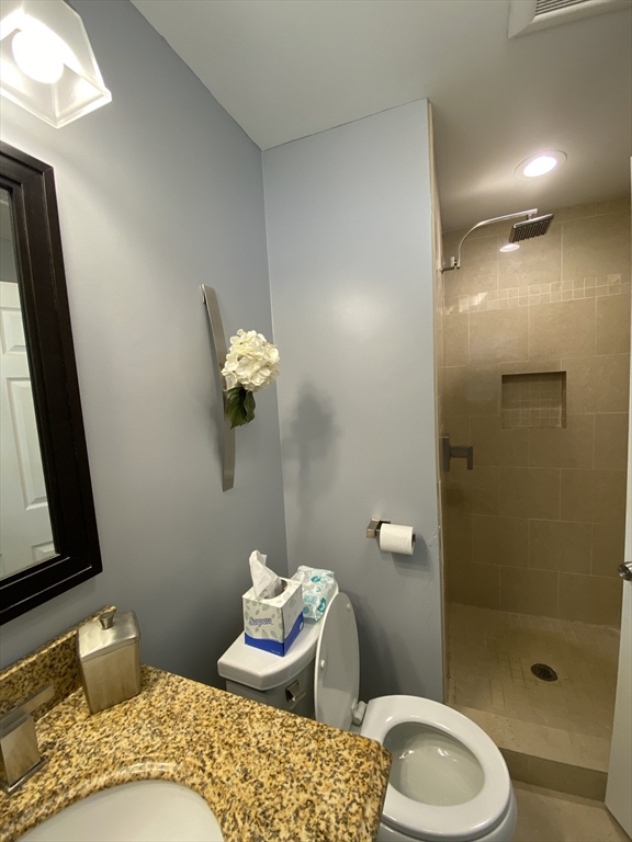 2 Travis Road Natick, MA 01760 - Photo 9 of 18 a bathroom with a toilet sink and shower
