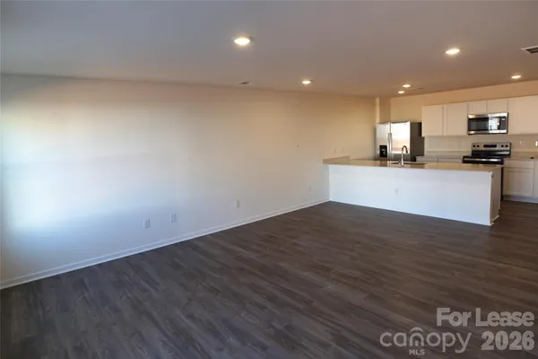 a view of kitchen with wooden floor