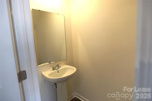 a bathroom with a sink and mirror
