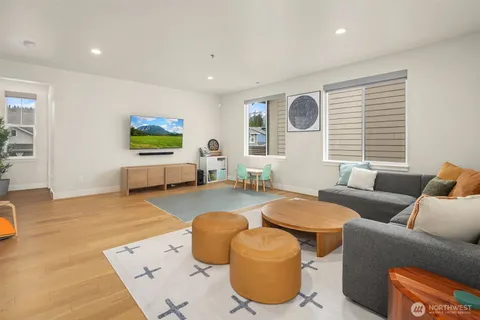 a living room with a couch and a window