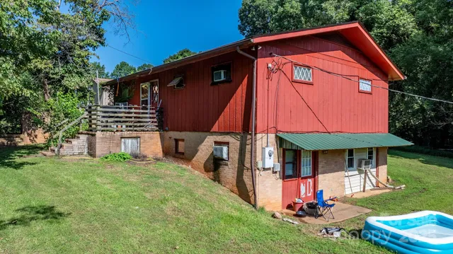 a front view of house with yard and outdoor seating