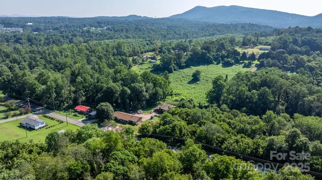 an aerial view of a house with mountain view