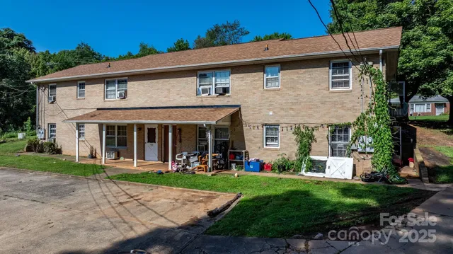 a front view of a house with a yard and porch