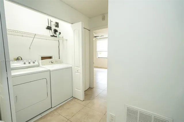 a utility room with dryer and washer