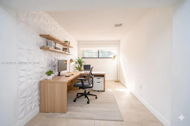 a workspace with furniture and window