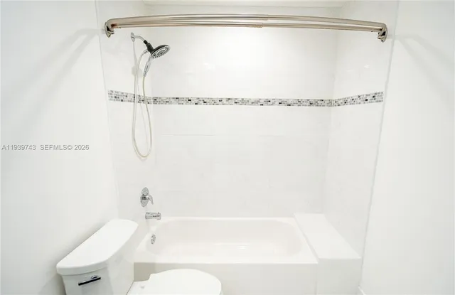 a bathroom with a shower and a bathtub