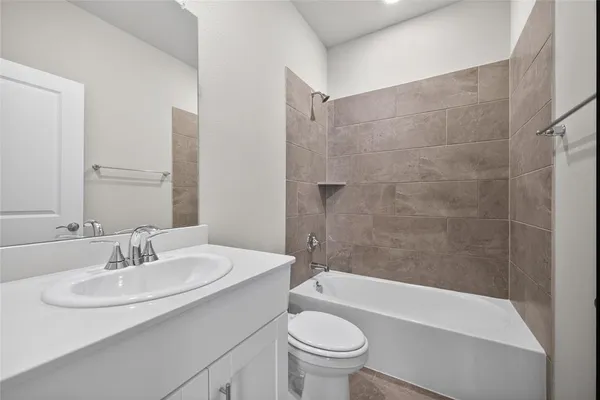 a bathroom with a sink a toilet and a bathtub