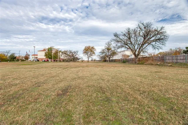 a view of a lake with a building in the background
