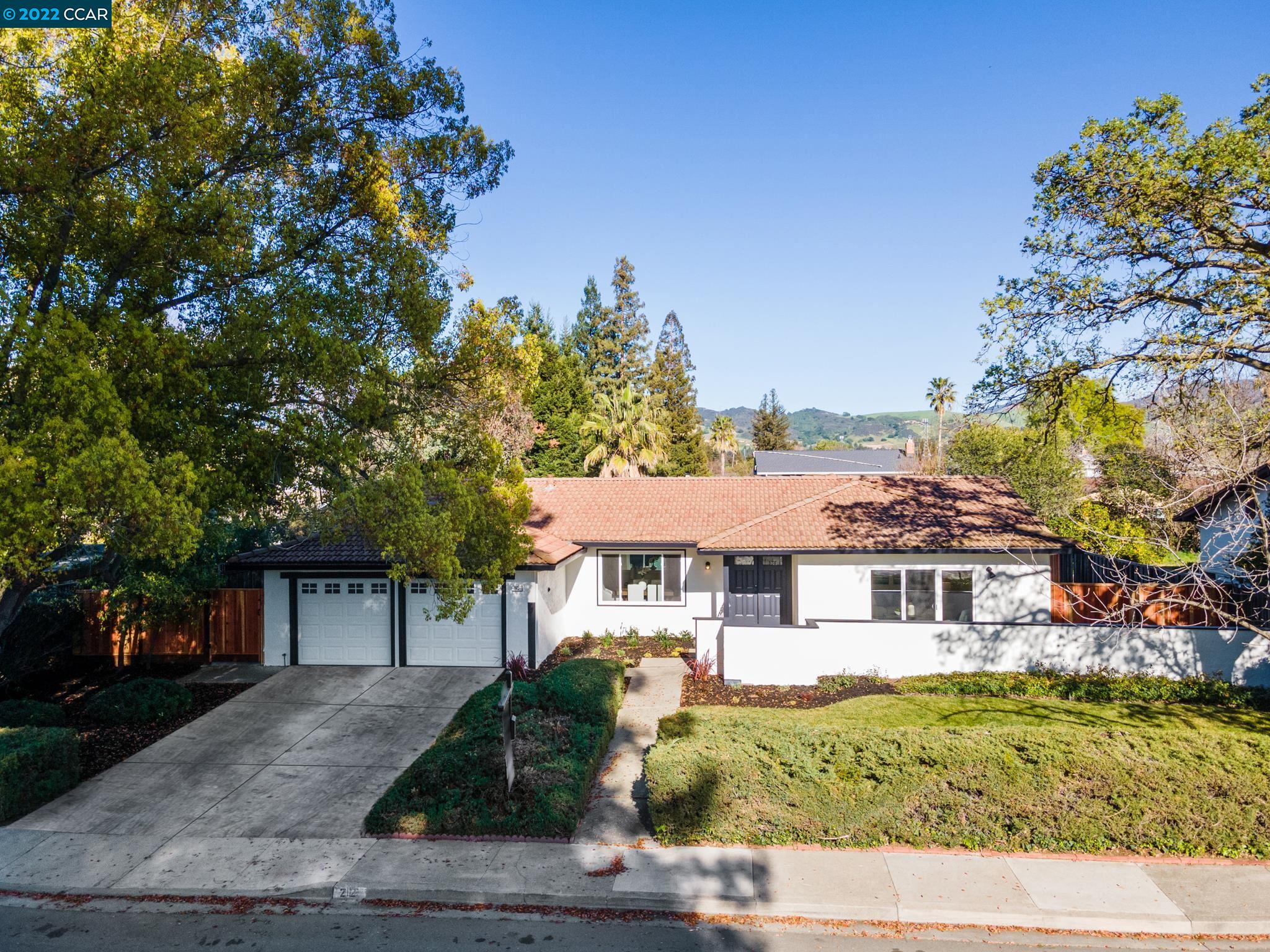 212 Wiget Lane Walnut Creek, CA 94598 - Photo 1 of 1 a front view of a house with a garden