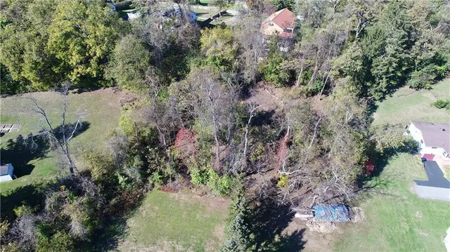 a backyard of a house with a yard with outdoor seating
