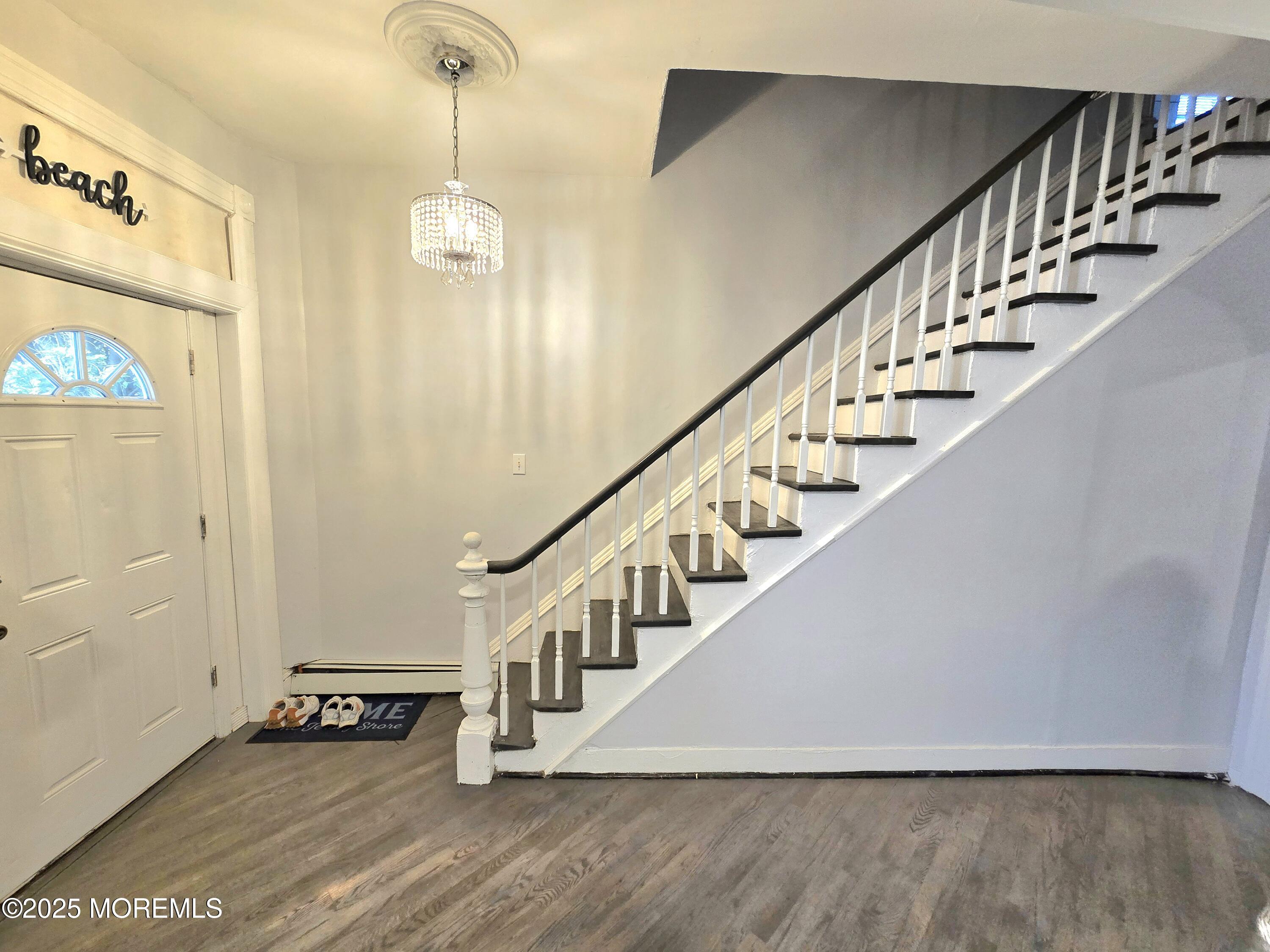 305 3rd Avenue, Unit 1 Asbury Park, NJ 07712 - Photo 4 of 13 a view of an entryway with wooden floor