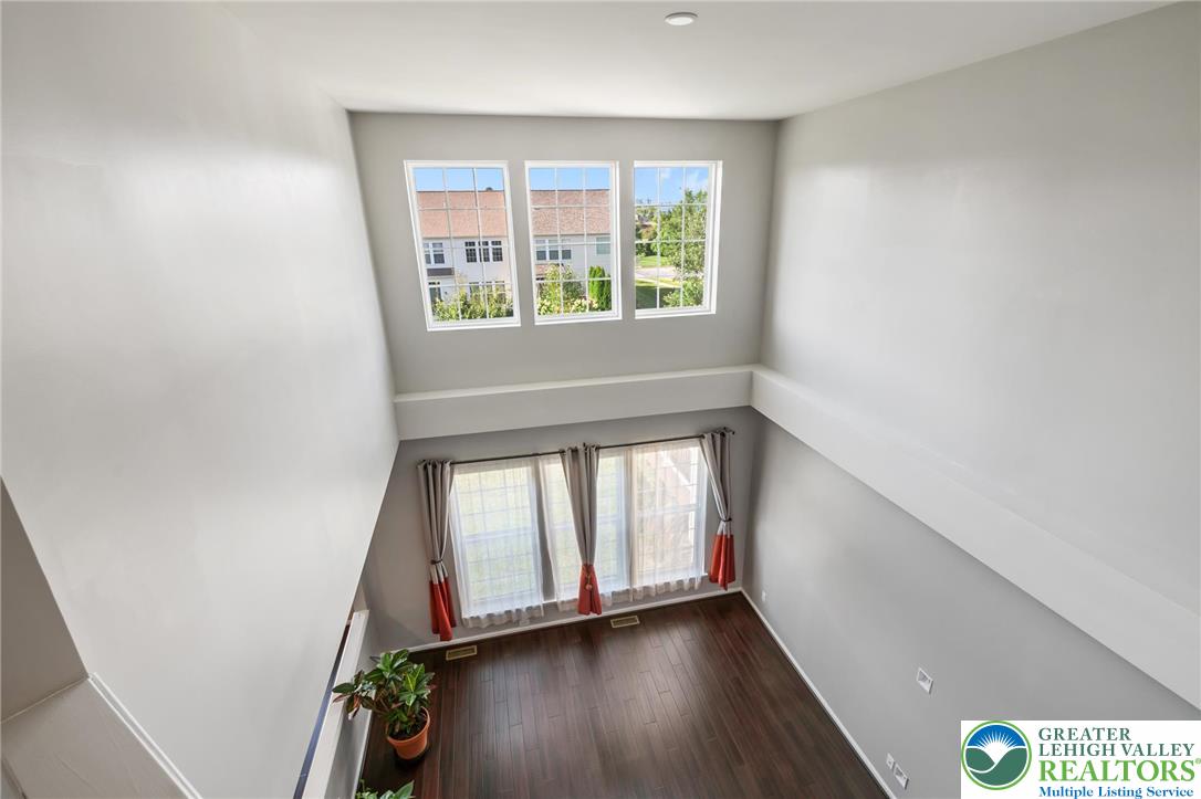 8455 Starling Road Breinigsville, PA 18031 - Photo 12 of 24 A spacious living area with soaring ceilings and gleaming hardwood floors.