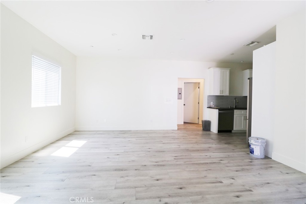 14254 Erwin Street Van Nuys, CA 91401 - Photo 4 of 18 a view of empty room with wooden floor