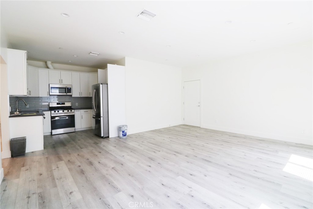 14254 Erwin Street Van Nuys, CA 91401 - Photo 6 of 18 a view of kitchen with wooden floor
