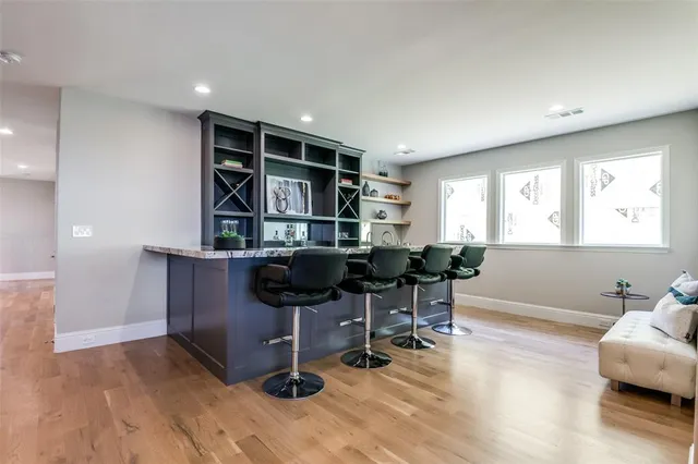 a workspace with furniture and a wooden floor