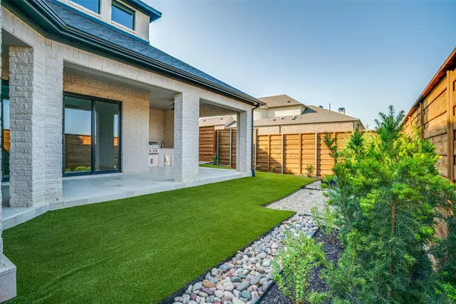 a view of a back yard from a patio