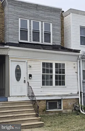 a front view of a house with a large window