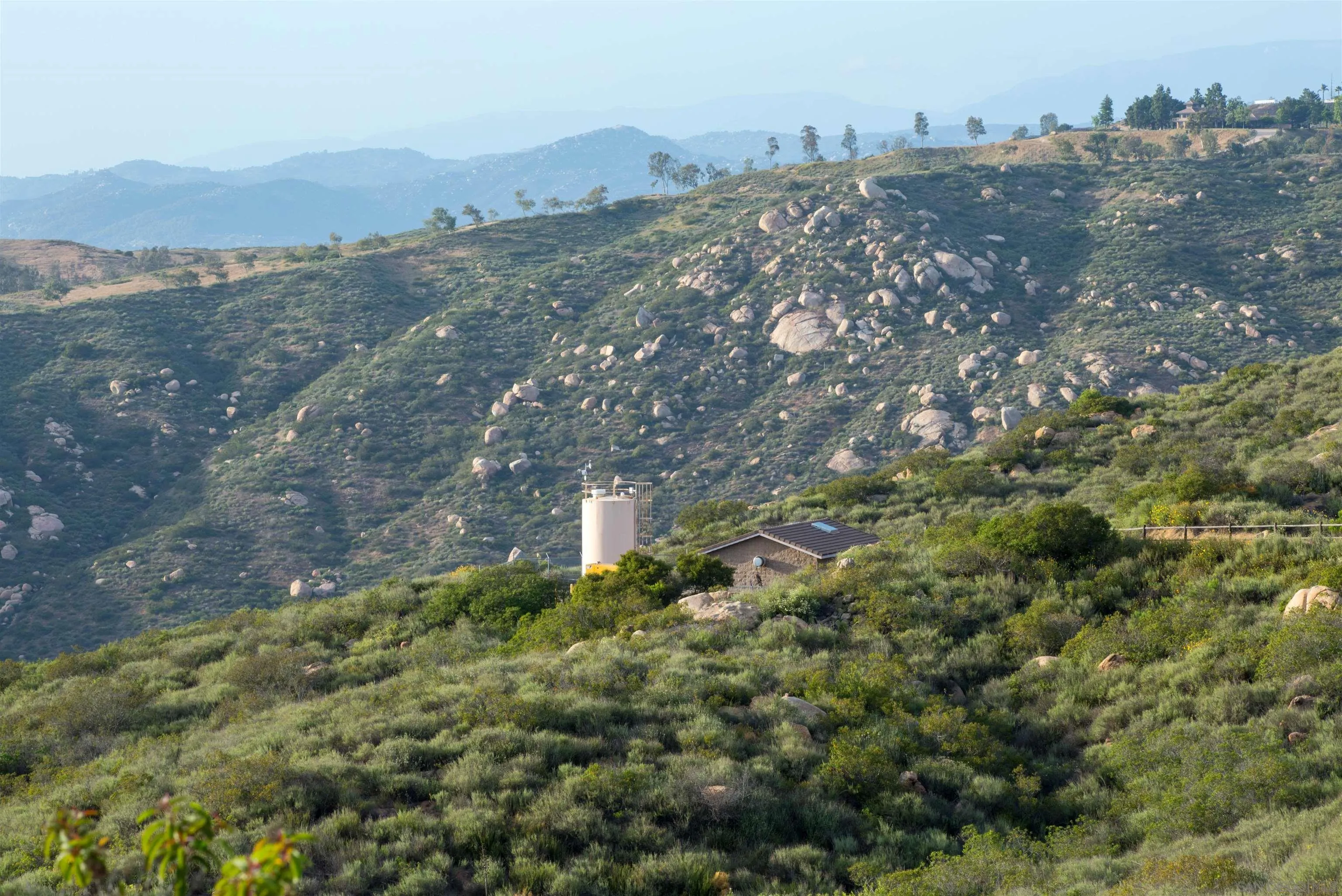 18035 Sunset Point, Unit 3 Poway, CA 92064 - Photo 27 of 62 an aerial view of house with yard and mountain view in back