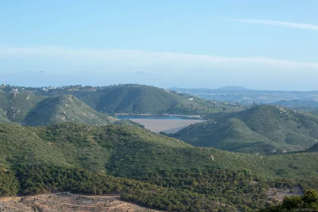 a view of a lake with a yard