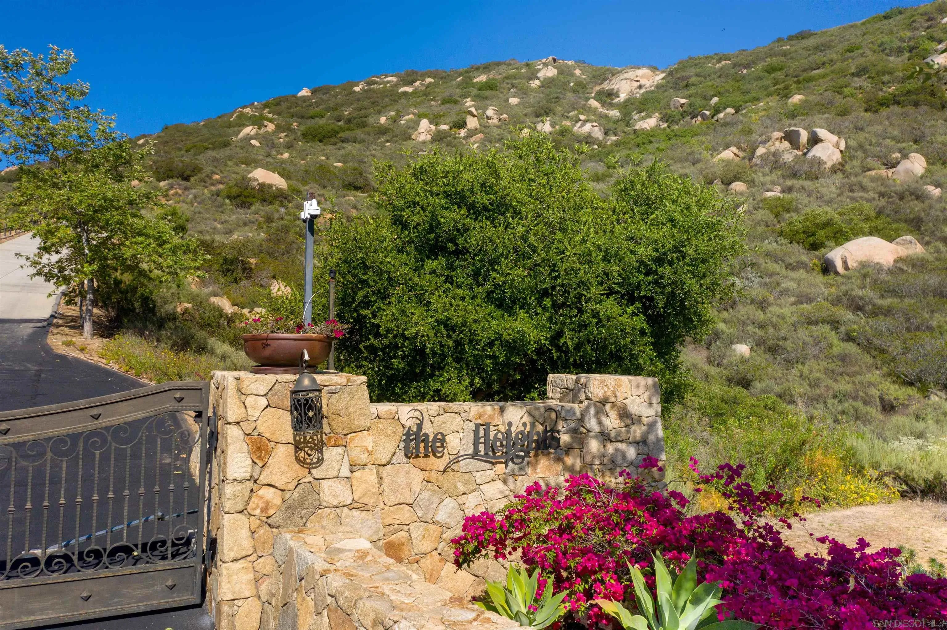18035 Sunset Point, Unit 3 Poway, CA 92064 - Photo 53 of 61 a view of a backyard with flowers and tree