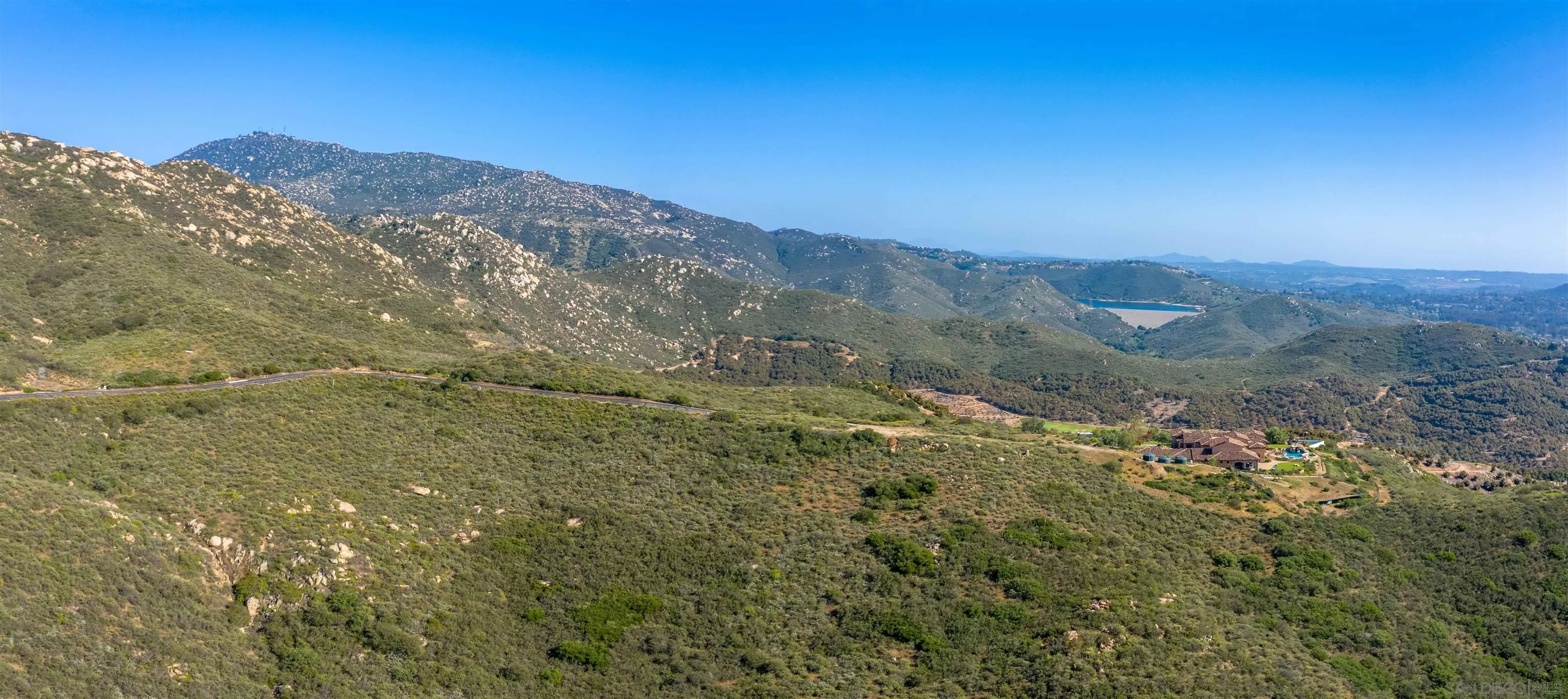 18035 Sunset Point, Unit 3 Poway, CA 92064 - Photo 57 of 61 a view of a dry yard with mountains in the background