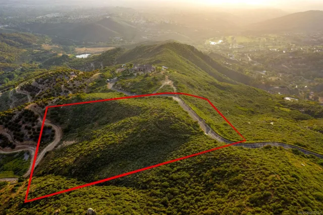 a view of a mountain range in a cloudy sky
