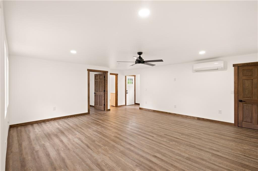 480 Freeman Falls Road Acme, PA 15610 - Photo 13 of 45 a view of an empty room with wooden floor and a window