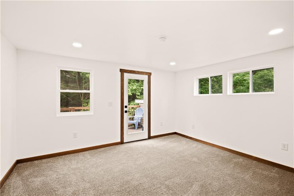 480 Freeman Falls Road Acme, PA 15610 - Photo 21 of 45 an empty room with windows