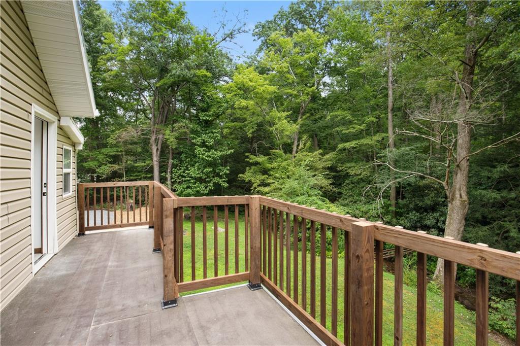 480 Freeman Falls Road Acme, PA 15610 - Photo 23 of 45 a balcony with trees in front of it