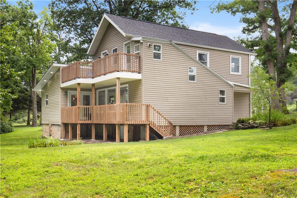 480 Freeman Falls Road Acme, PA 15610 - Photo 33 of 45 a front view of a house with a yard and trees