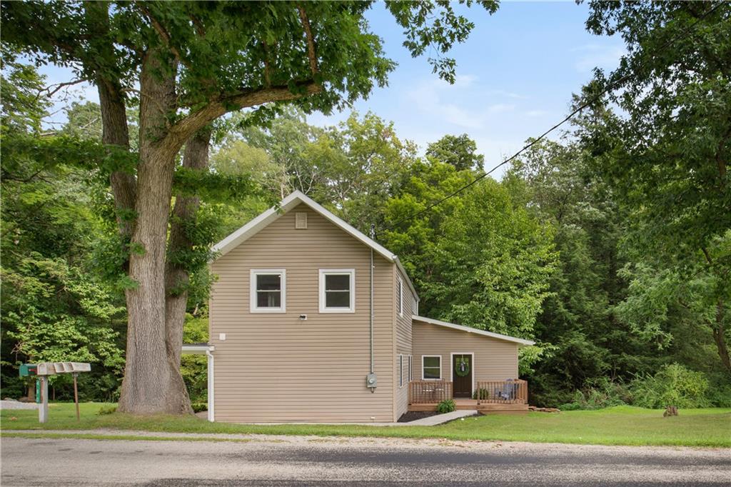 480 Freeman Falls Road Acme, PA 15610 - Photo 40 of 45 a view of a house with a yard