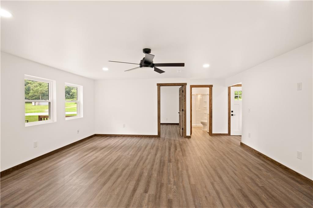 480 Freeman Falls Road Acme, PA 15610 - Photo 10 of 45 a view of an empty room with wooden floor and a window