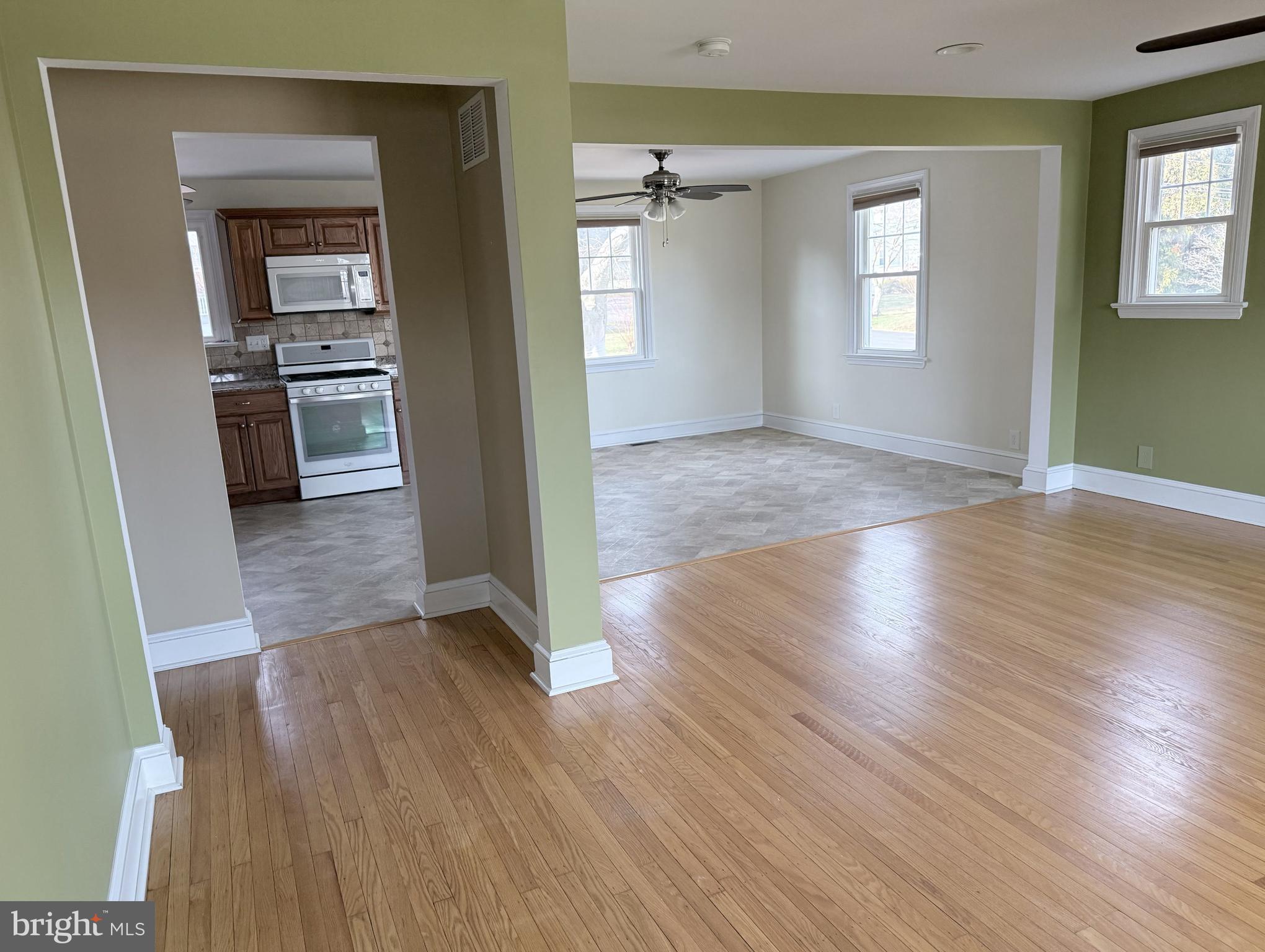 302 South Valley Forge Road Devon, PA 19333 - Photo 13 of 28 an empty room with wooden floor and windows