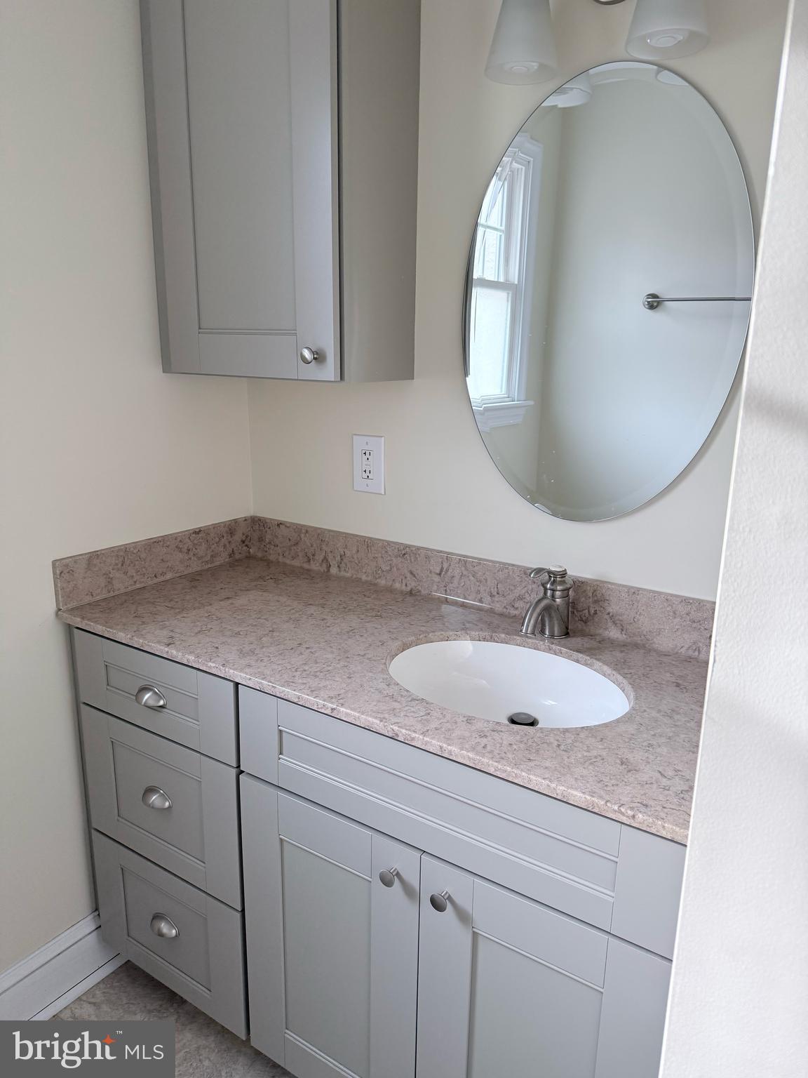 302 South Valley Forge Road Devon, PA 19333 - Photo 16 of 28 a bathroom with a granite countertop sink and mirror