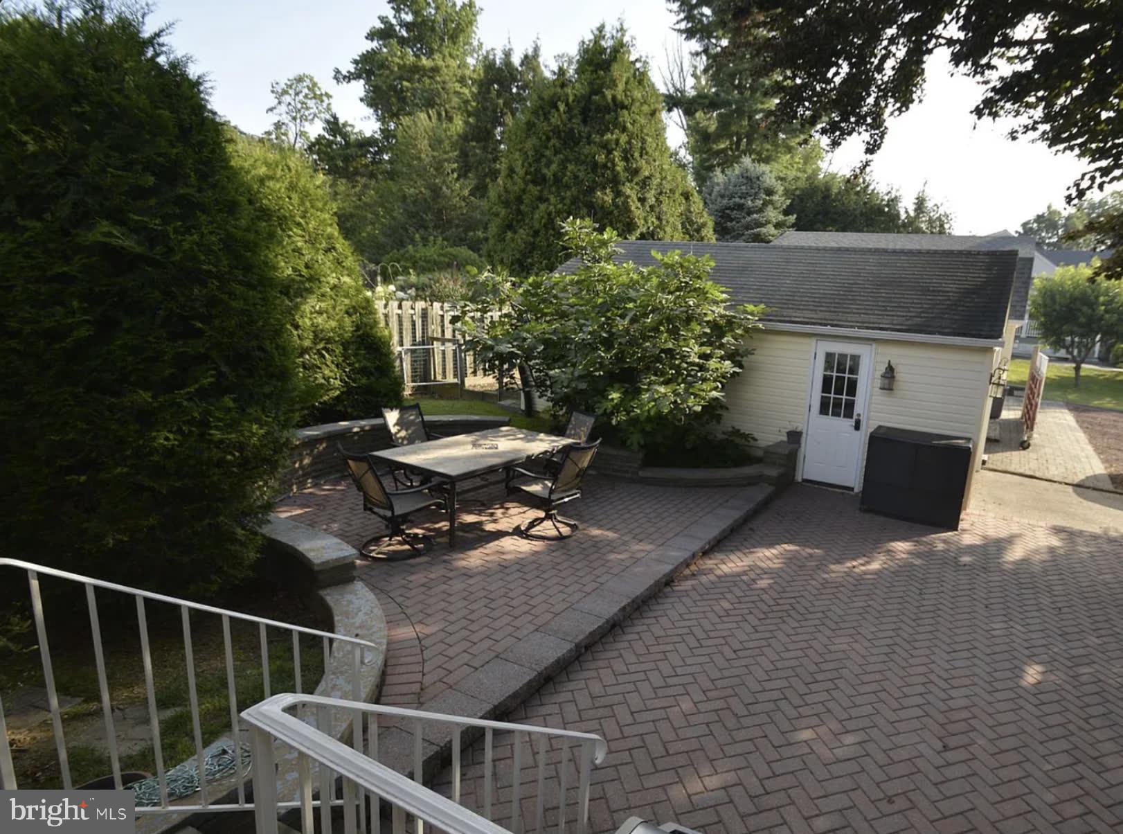 302 South Valley Forge Road Devon, PA 19333 - Photo 7 of 28 a view of a patio with table and chairs with wooden fence and plants