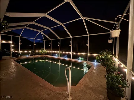 a view of a swimming pool with a patio