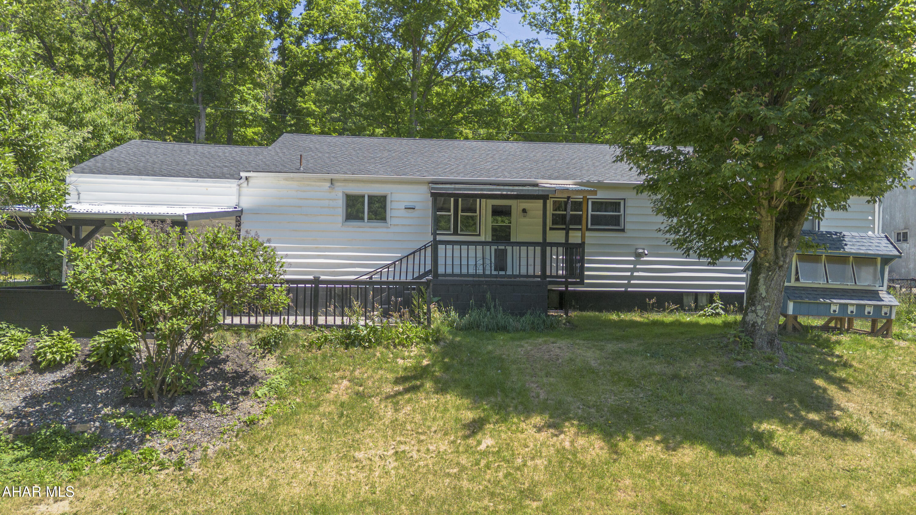 871 Decker Hollow Road Tyrone, PA 16686 - Photo 4 of 35 front view of a house with a yard
