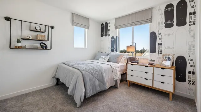 a bedroom with bed and window