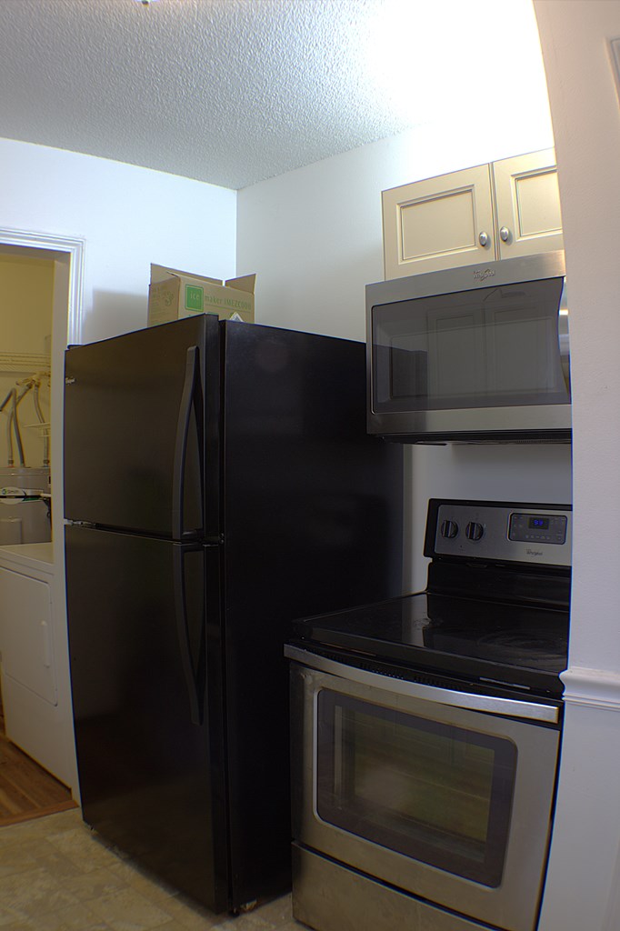 125 Moore View Drive Murphy, NC 28906 - Photo 11 of 49 a kitchen with a refrigerator stove and microwave