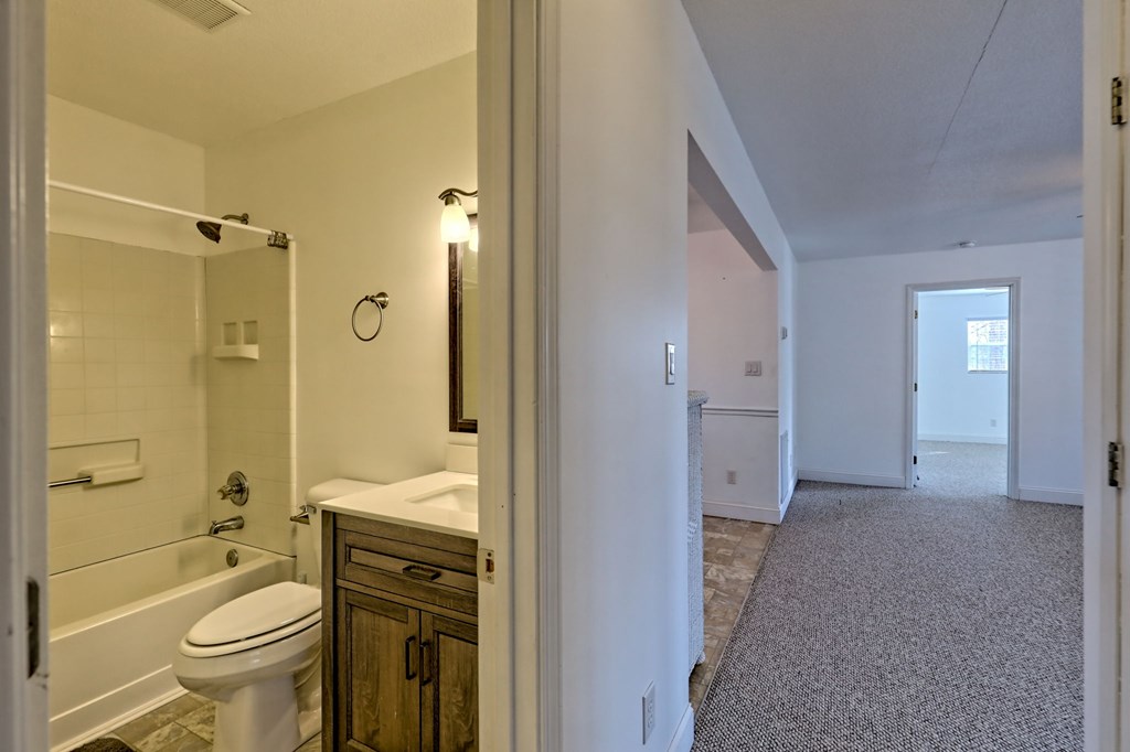 125 Moore View Drive Murphy, NC 28906 - Photo 41 of 49 a bathroom with a granite countertop toilet sink and shower